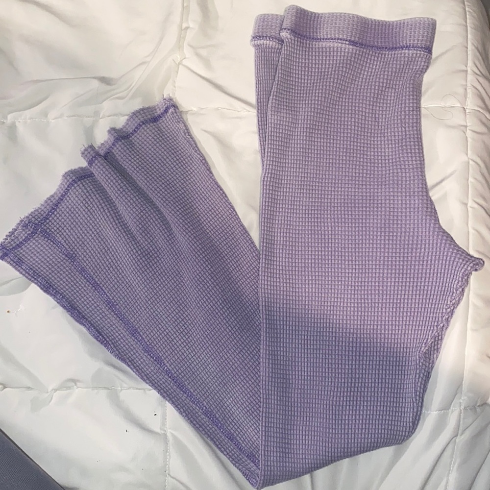 Purple textured flare pants.